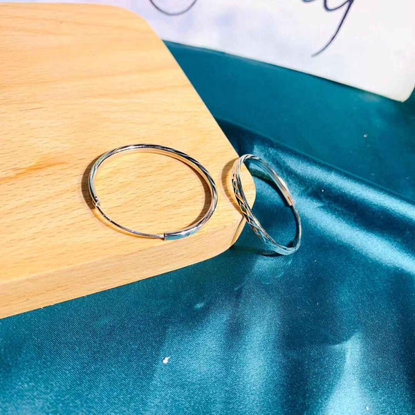 Diamond-shaped pattern surface sterling silver hoop earrings